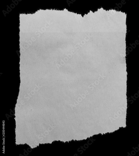 Torn paper on black © Stillfx