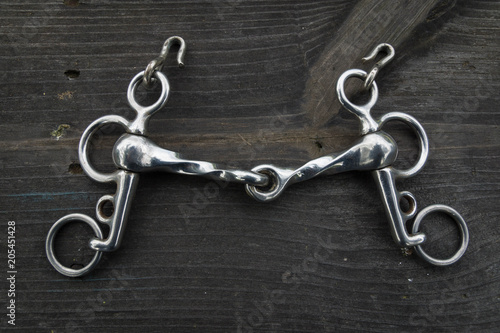 Horse equipment on wood