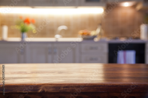 blurred kitchen interior with wooden desk space © Melinda Nagy