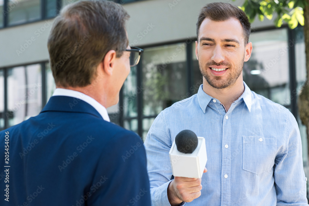 Journalists Filing Microphone Interviewing To Businessman. Smart Reporter  Taking Interview And Speech With Microphone At Presentation In Conference,  Business Seminar Concept Stock Photo, Picture and Royalty Free Image. Image  91376553.