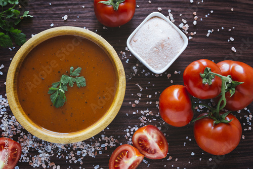 Tomato soup in a wooden bowl