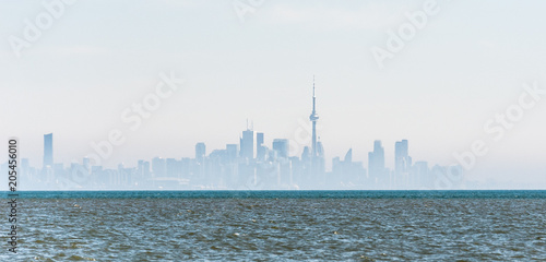Canvas Print Foggy city skyline of Toronto on Lake Ontario.
