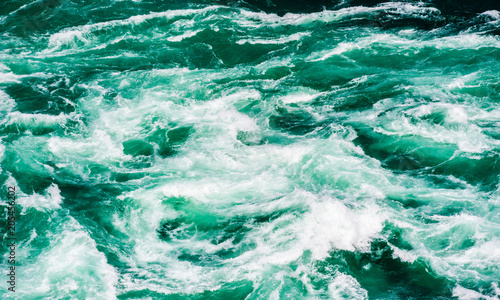 Abstract water currents and rapids in green river
