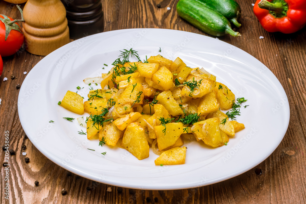 The potatoes wedges on a plate The potatoes wedges on a plate