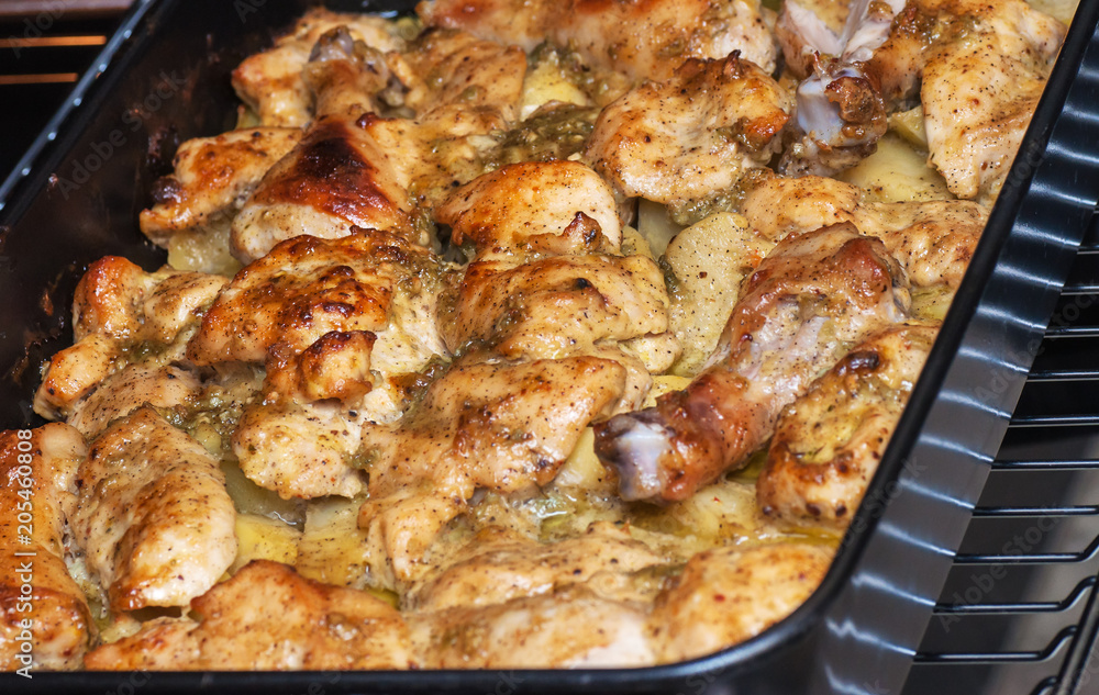 Grilled chicken with potatoes on the plate