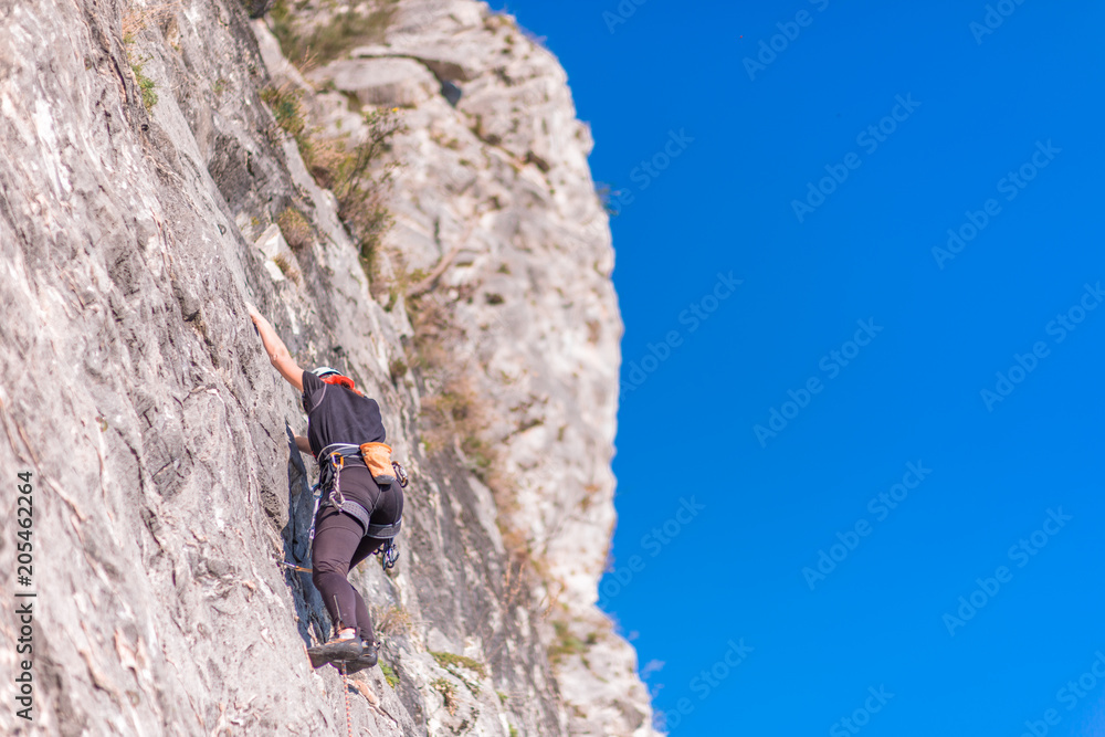 female hiker climb up the mountain