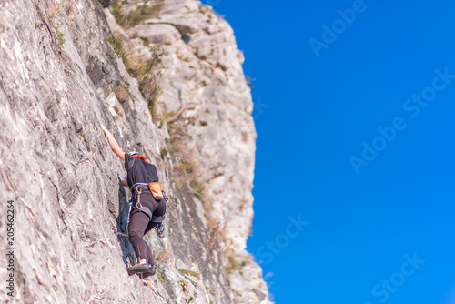 female hiker climb up the mountain
