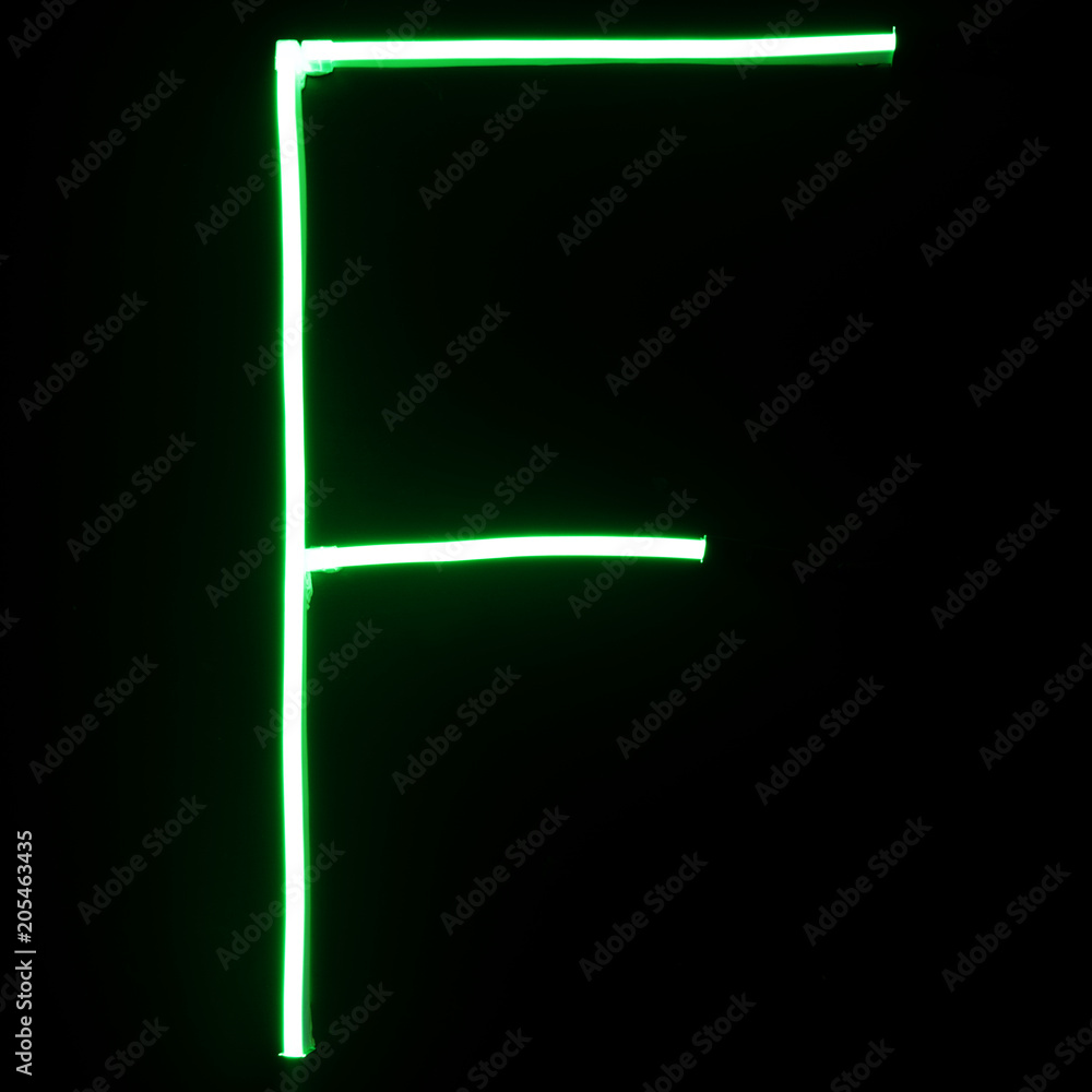 Green neon lights alphabet letters Green neon lights alphabet letters
