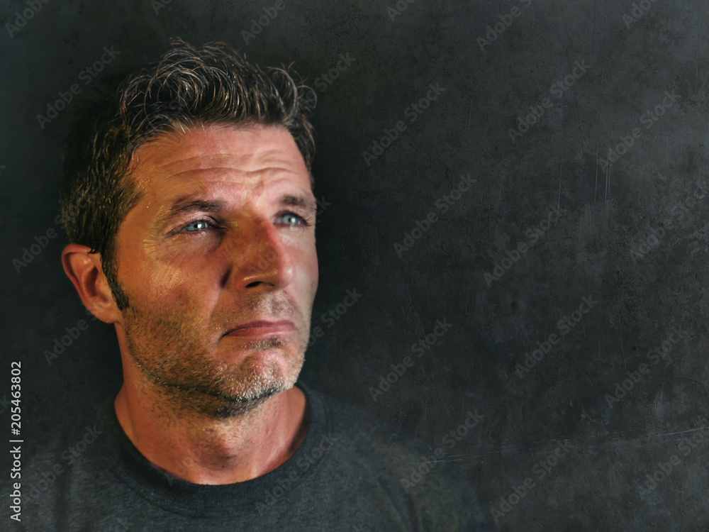 young sad and devastated man looking far away thoughtful and pensive feeling stressed and lost suffering pain and depression isolated on black young sad and devastated man looking far away thoughtful and pensive feeling stressed and lost suffering pain and depression isolated on black