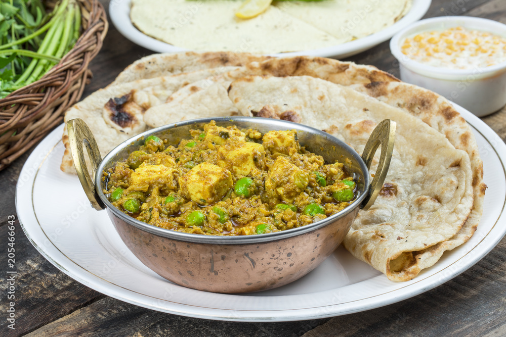 Indian Cuisine Mattar Paneer is a Vegetarian North Indian Dish Consisting of Peas And Paneer in a Tomato Based Sauce, Spiced with Garam Masala. It is often Served with Indian type of Tandoori Roti