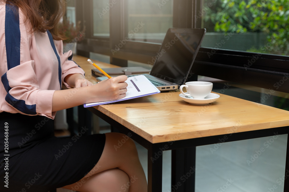 Business and finance concept, Businesswoman discussing sale analysis Chart in coffee shop Business and finance concept, Businesswoman discussing sale analysis Chart in coffee shop