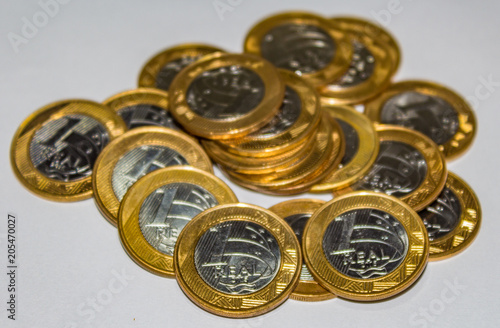 Bunch of real brazilian coins golden.