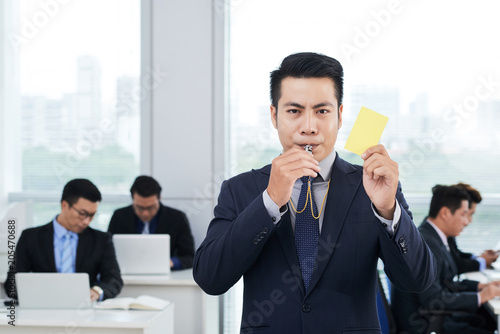 Asian Entrepreneur Showing Yellow Card