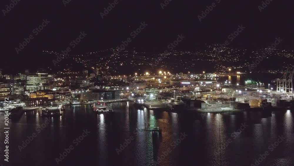 Aerial, City Harbor At Night, Boats Traveling Across Bay Aerial, City Harbor At Night, Boats Traveling Across Bay