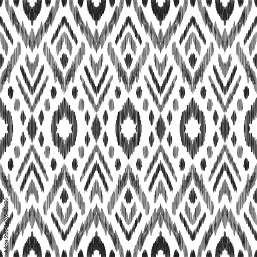 Tribal pattern. Seamless background. Scribble texture. Black and white graphic design. Creative vector illustration. Ethnic boho ornament. Impressive fashion print.