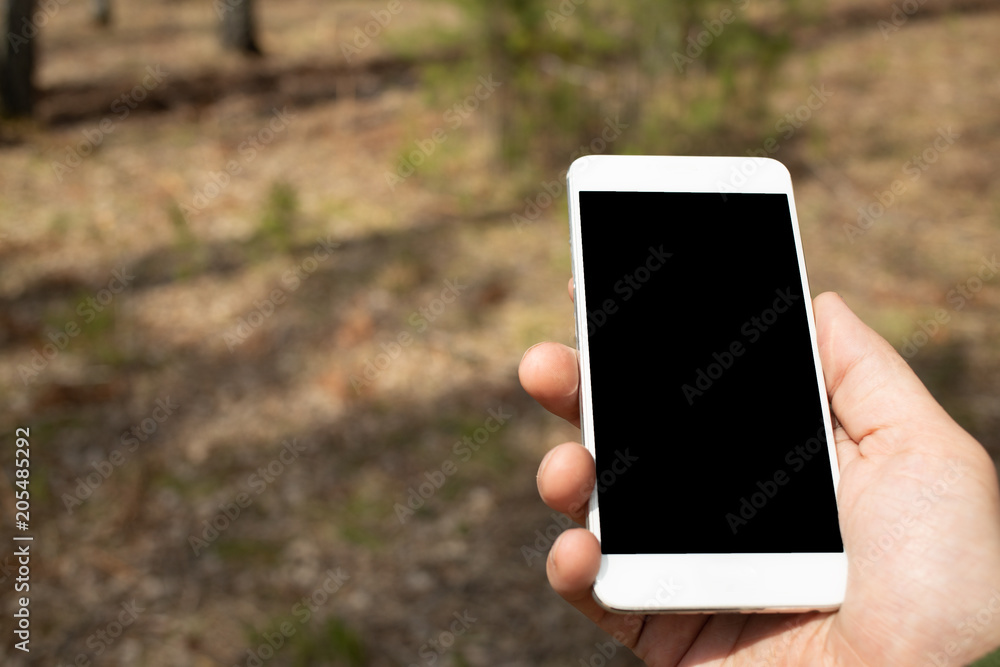 phone in hand outdoors