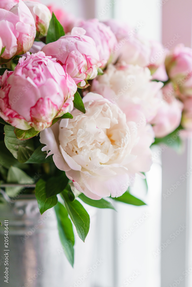 Obraz premium Beautiful bouquet of pink peonies . Floral composition, scene, daylight. Wallpaper. Vertical photo