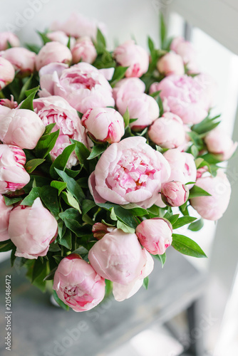 Beautiful bouquet of pink peonies . Floral composition, scene, daylight. Wallpaper. Vertical photo © malkovkosta