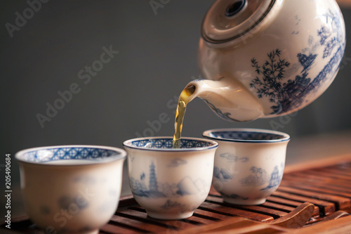 Cropped shot of pouring tea in traditional chinese teaware.