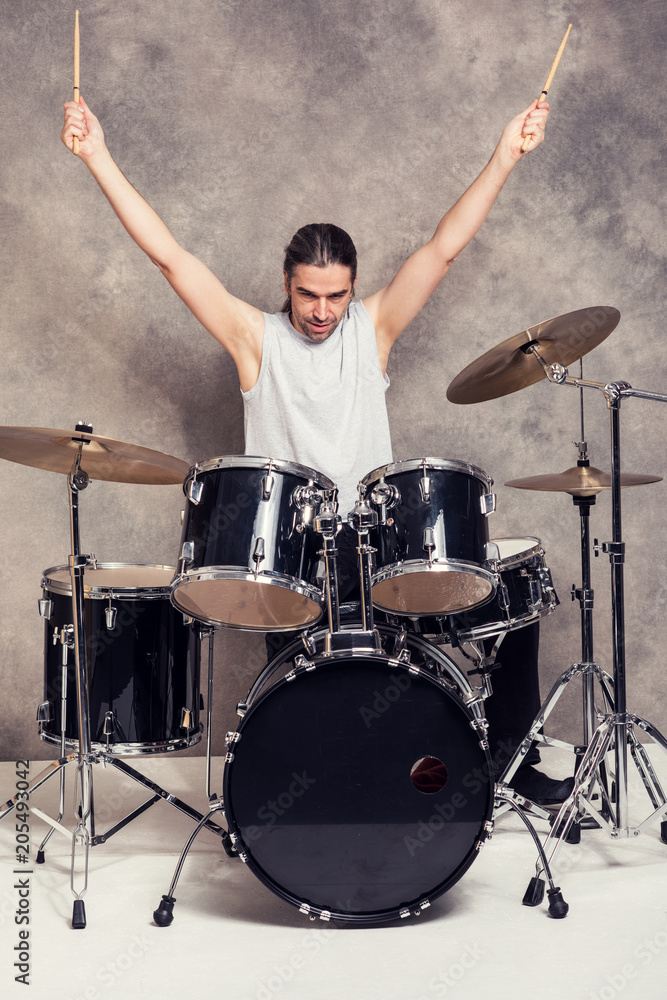 Fototapeta premium musician with his black drum set