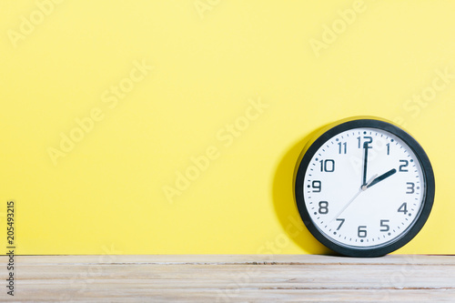 Wallpaper Mural Analog clock on wooden office desk with copy space Torontodigital.ca