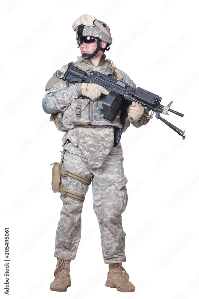 Full length portrait of equipped US army soldier in camouflage uniform, helmet and body armor standing with light machine gun in hands isolated on white background Armed marine infantryman studio shot