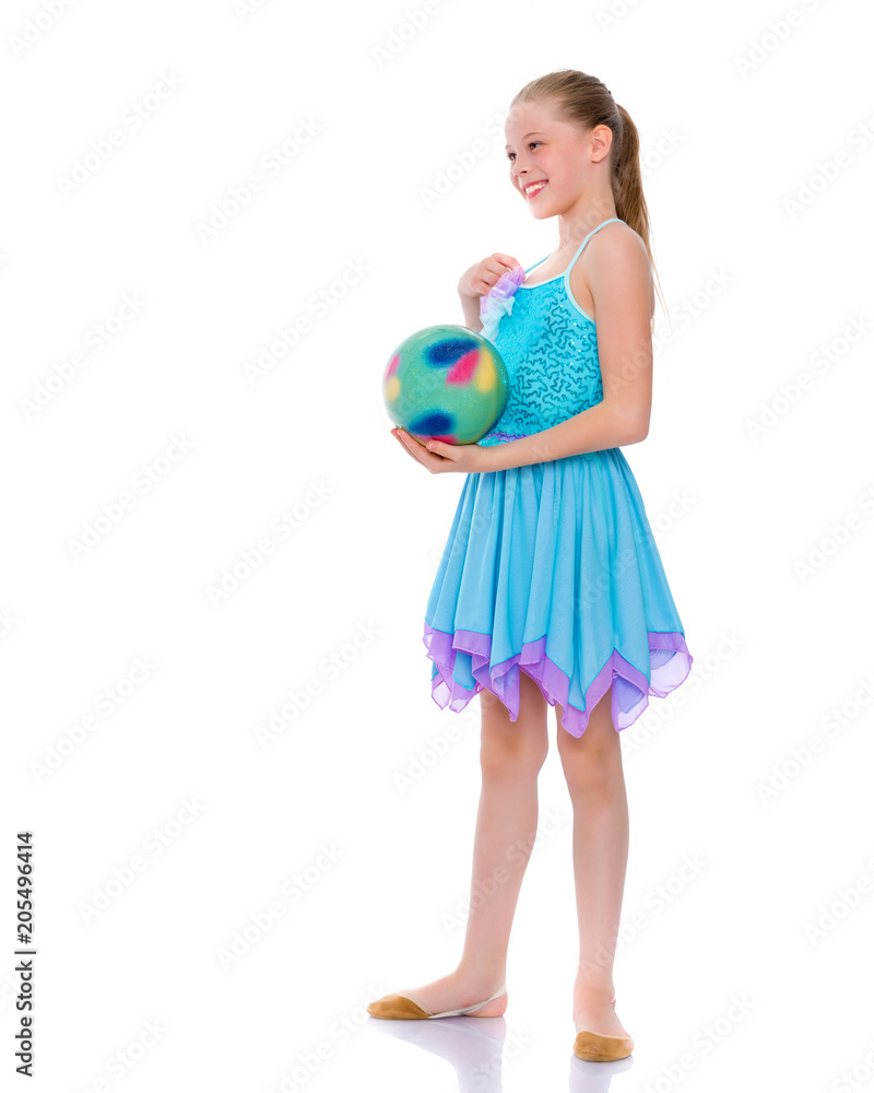 Girl gymnast performs exercises with the ball. Girl gymnast performs exercises with the ball.