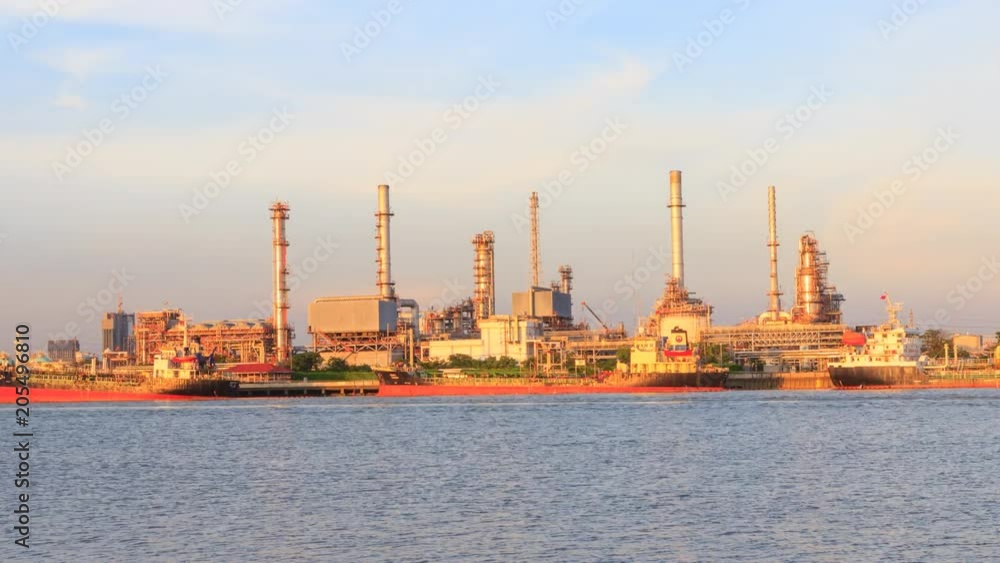 Zoom in time lapse of Oil refinery at the river in sunset time / Big Factory in sunset time Zoom in time lapse of Oil refinery at the river in sunset time / Big Factory in sunset time