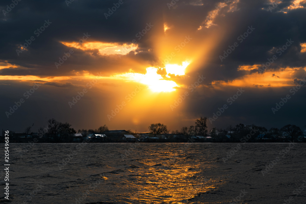 Divine sunset on the lake near the village