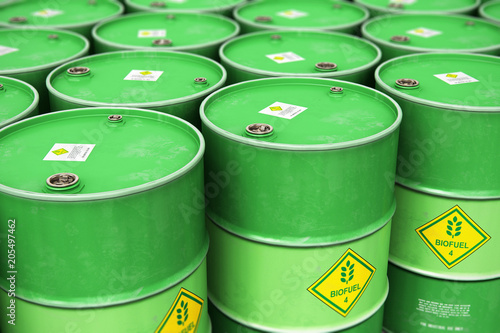 Group of rows of green stacked biofuel drums in storage warehouse photo