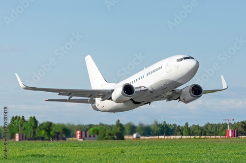 Passenger plane without landing gear flying very low pass over the runway at the airport