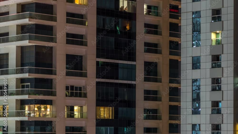 Scenic glowing windows of skyscrapers at evening timelapse Scenic glowing windows of skyscrapers at evening timelapse