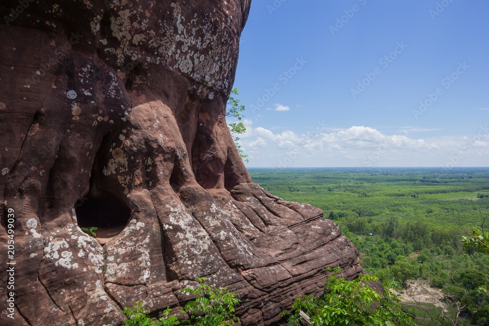Beautiful scenery of the sandstone cliff with the jungle and blue sky in the background, Phu Sing, Bueng Kan, Thailand