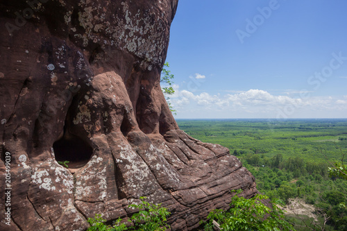 Beautiful scenery of the sandstone cliff with the jungle and blue sky in the background, Phu Sing, Bueng Kan, Thailand