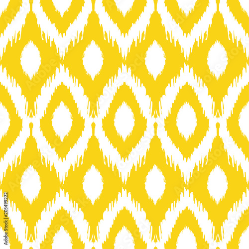 Seamless ikat pattern in yellow and grey colors. Vector tribal background