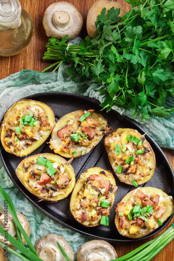 Baked potatoes in jacket stuffed with bacon, mushrooms and chees Baked potatoes in jacket stuffed with bacon, mushrooms and chees