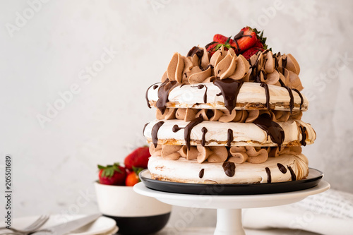 Pavlova cake with strawberry, chocolate.Festive atmosphere.Copy space. photo