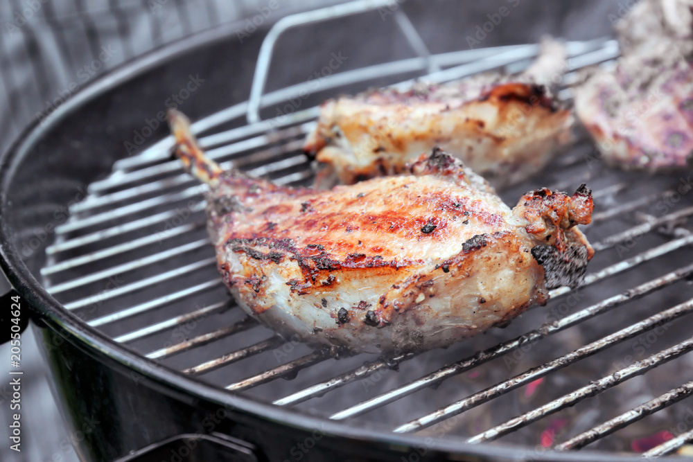Cooking of appetizing juicy spare ribs outdoors Cooking of appetizing juicy spare ribs outdoors