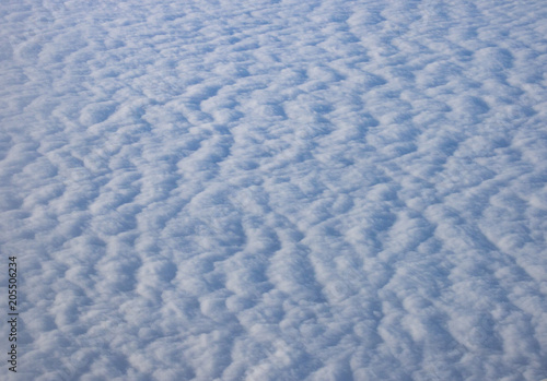 view of the clouds from the plane window