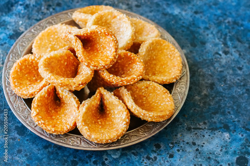 Honey and sesame babouches - popular arabic dessert. Arabic and middle eastern food concept photo