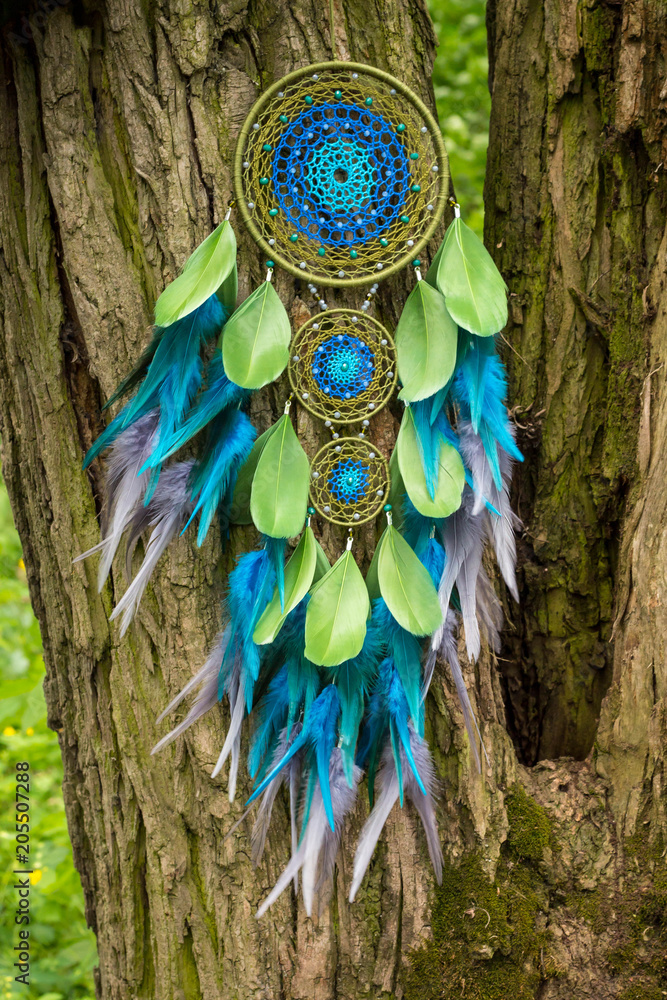 Handmade dream catcher with feathers threads and beads rope hanging Handmade dream catcher with feathers threads and beads rope hanging