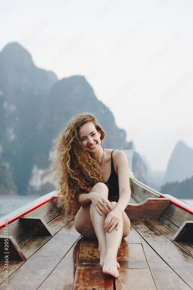 Beautiful woman posing on a boat Beautiful woman posing on a boat