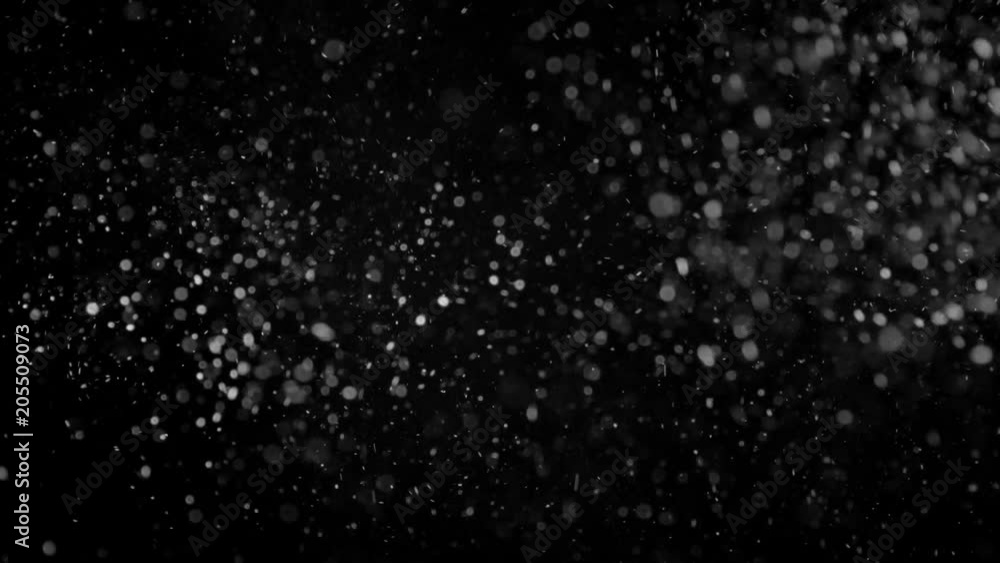 Natural Organic Dust Particles Floating On Black Background. Glittering Sparkling Particles Randomly Spin In The Air With Bokeh. Dynamic Particles With Fast And Slow Motion. Shimmering Dust In Space. Natural Organic Dust Particles Floating On Black Background. Glittering Sparkling Particles Randomly Spin In The Air With Bokeh. Dynamic Particles With Fast And Slow Motion. Shimmering Dust In Space.