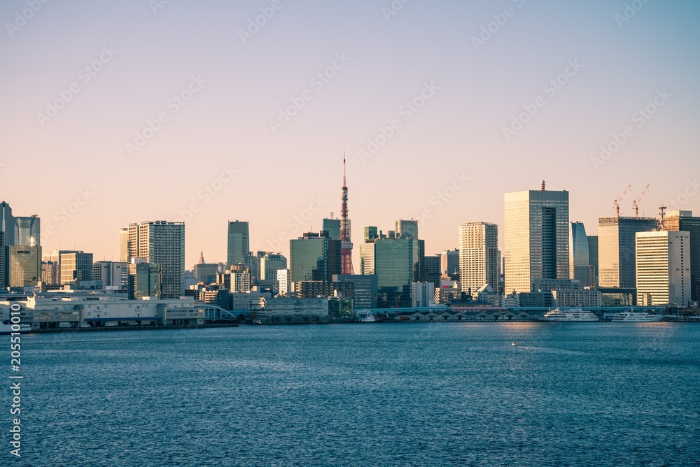 Fototapeta premium Seaside cityscape in evening sunny day background, Tokyo Japan