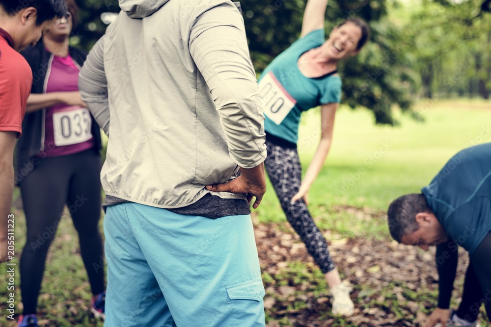 Group of diverse athlete are stretching their muscle Group of diverse athlete are stretching their muscle