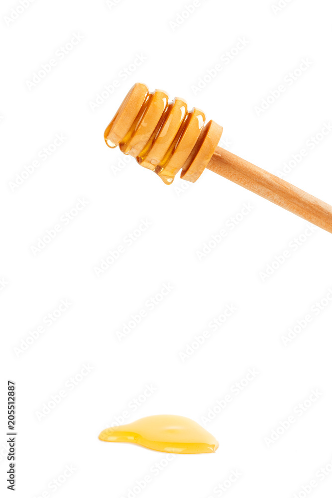 honey with wooden drizzler isolated on white background honey with wooden drizzler isolated on white background