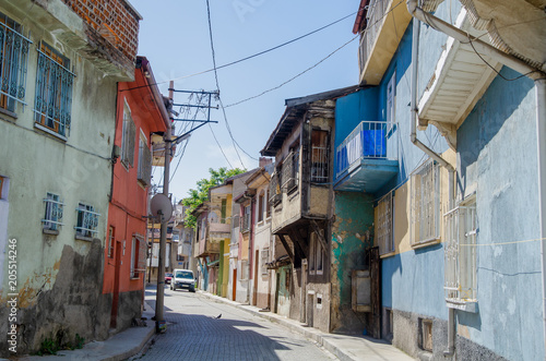 Beautiful old street in downtown with houses with wooden shutters in the classic Turkish Ottoman style Afyon in Turkey 