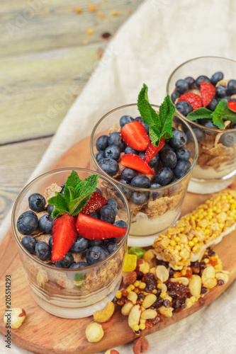 Granola, yogurt and strawberries in a jars