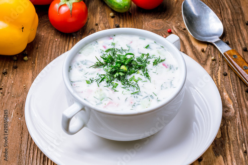 Okroshka on kefir on wooden table