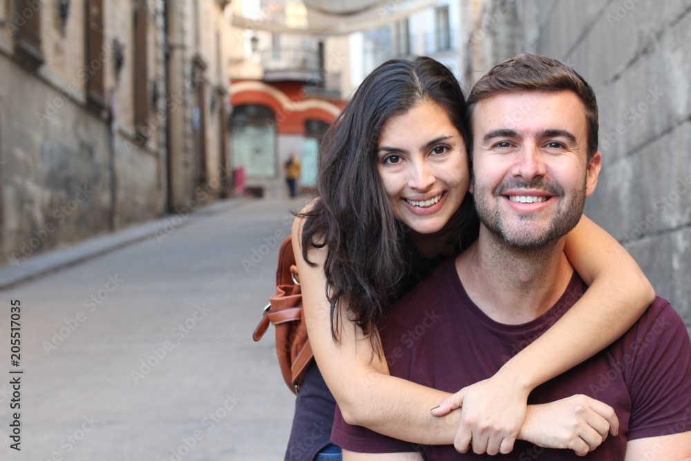 Fototapeta premium Happy interracial couple smiling outdoors 